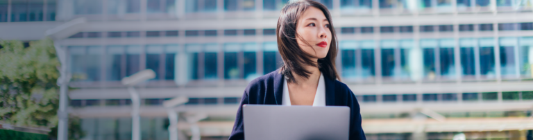 woman outside with laptop